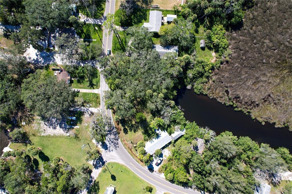 18905 Aripeka Road Aripeka, FL 34679 - Photo 42 of 43 an aerial view of a house with a yard and outdoor seating