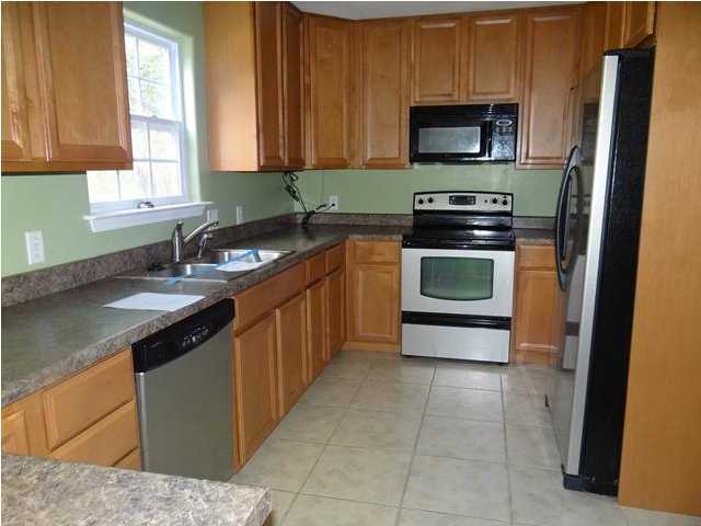 70 Cypress Lane Freeport, FL 32439 - Photo 3 of 21 a kitchen with a sink stove and microwave