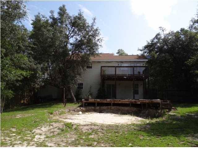 70 Cypress Lane Freeport, FL 32439 - Photo 21 of 21 a view of a house with a yard