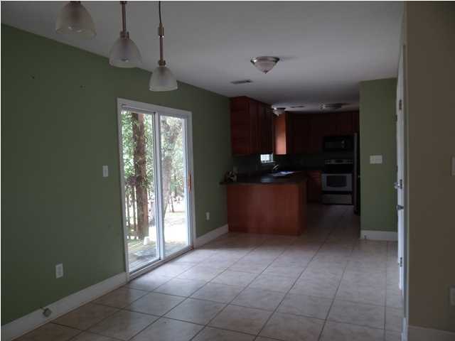 70 Cypress Lane Freeport, FL 32439 - Photo 5 of 21 a kitchen with stainless steel appliances granite countertop a refrigerator and a sink