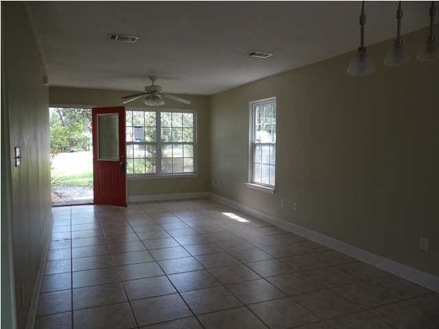 70 Cypress Lane Freeport, FL 32439 - Photo 7 of 21 a view of an empty room and window
