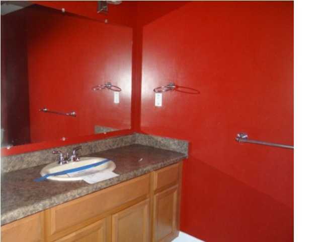 70 Cypress Lane Freeport, FL 32439 - Photo 8 of 21 a bathroom with a granite countertop sink and a mirror