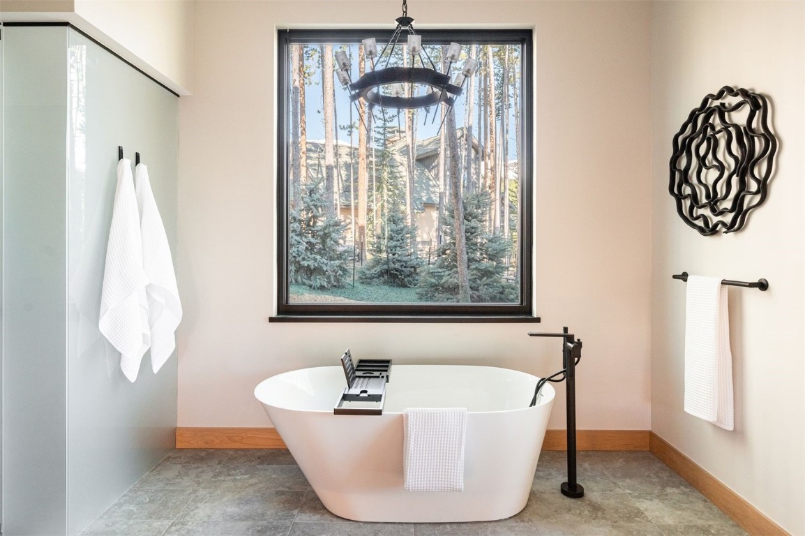 119 Boulder Circle Breckenridge, CO 80424 - Photo 22 of 50 a bath tub sitting in a bathroom next to a window
