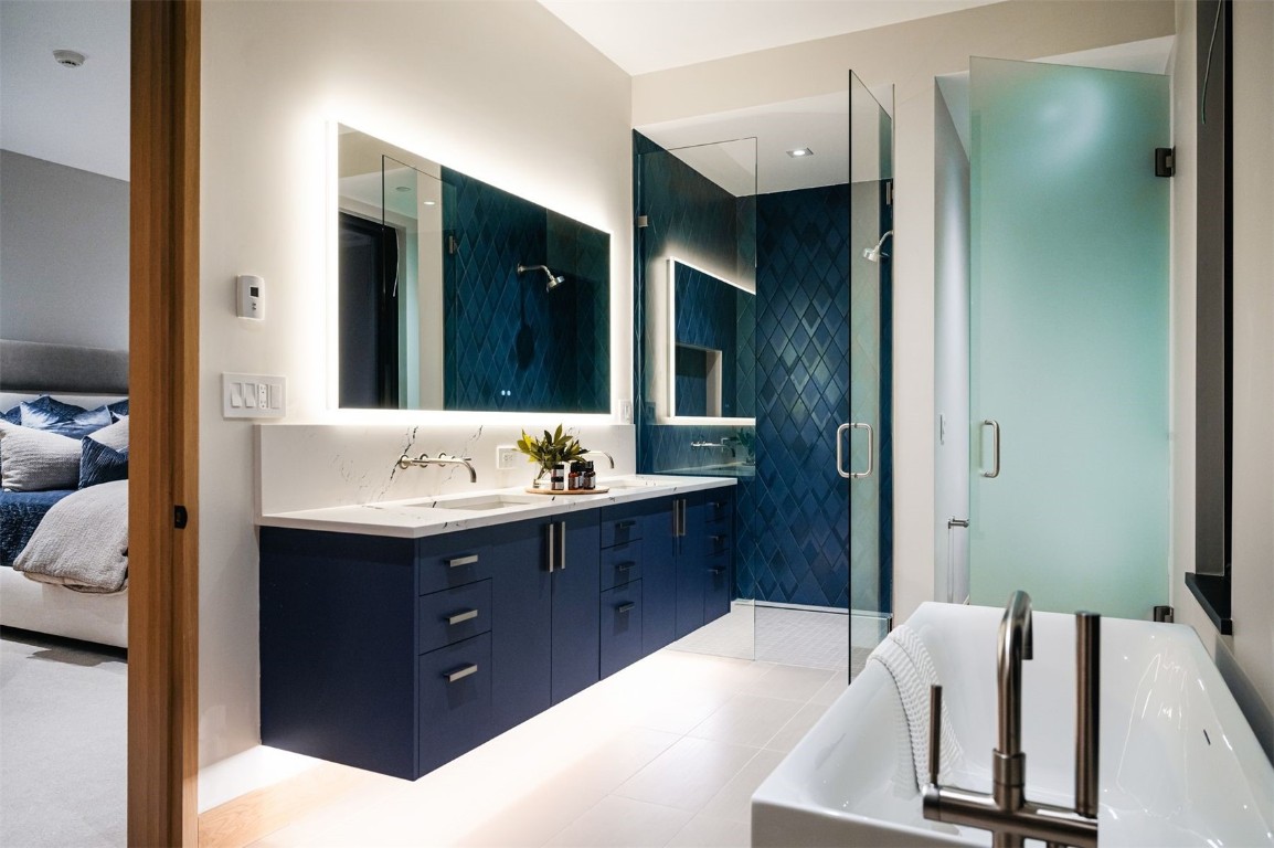 119 Boulder Circle Breckenridge, CO 80424 - Photo 32 of 50 a bathroom with a double vanity sink and mirror