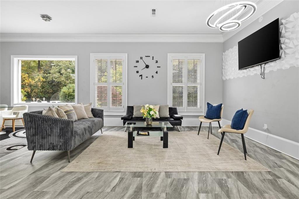 3687 Briarcliff Road Northeast Atlanta, GA 30345 - Photo 111 of 131 a living room with furniture a flat screen tv and a large window
