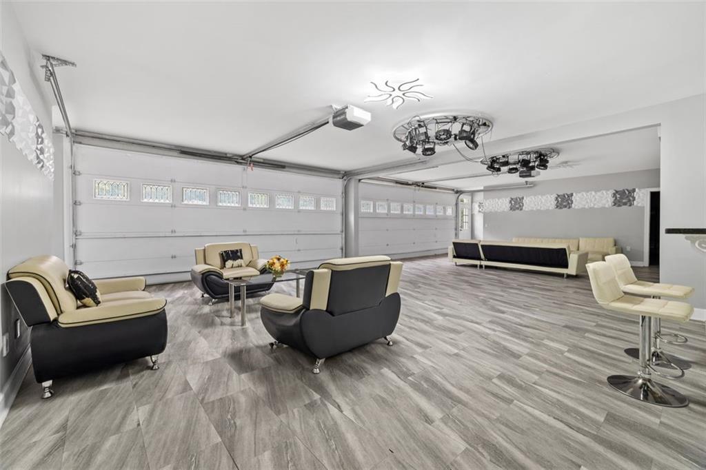 3687 Briarcliff Road Northeast Atlanta, GA 30345 - Photo 128 of 131 a living room with furniture and wooden floor