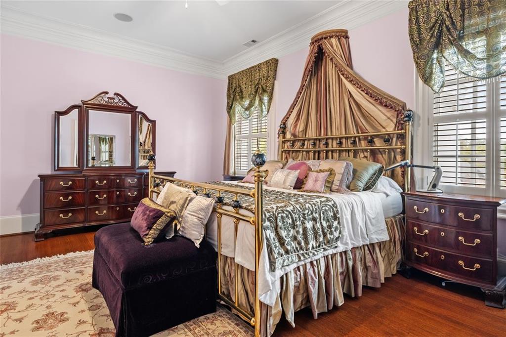 3687 Briarcliff Road Northeast Atlanta, GA 30345 - Photo 42 of 131 a bedroom with a bed a dresser and mirror