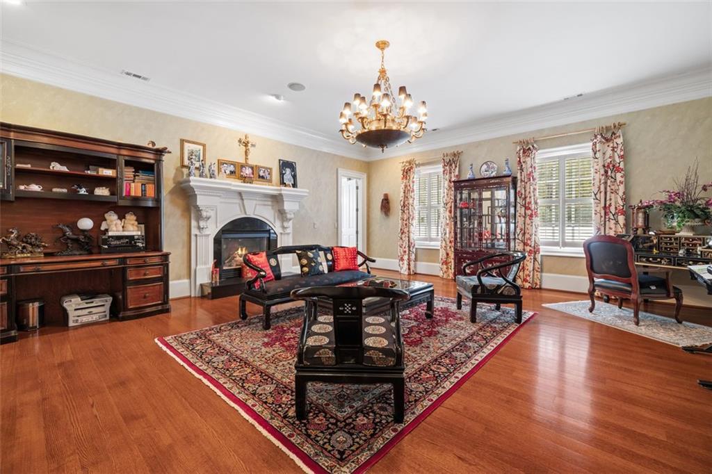 3687 Briarcliff Road Northeast Atlanta, GA 30345 - Photo 43 of 131 a living room with furniture a fireplace and a flat screen tv
