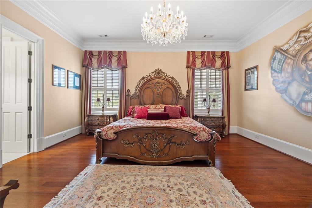 3687 Briarcliff Road Northeast Atlanta, GA 30345 - Photo 46 of 131 a bedroom with a bed and wooden floor