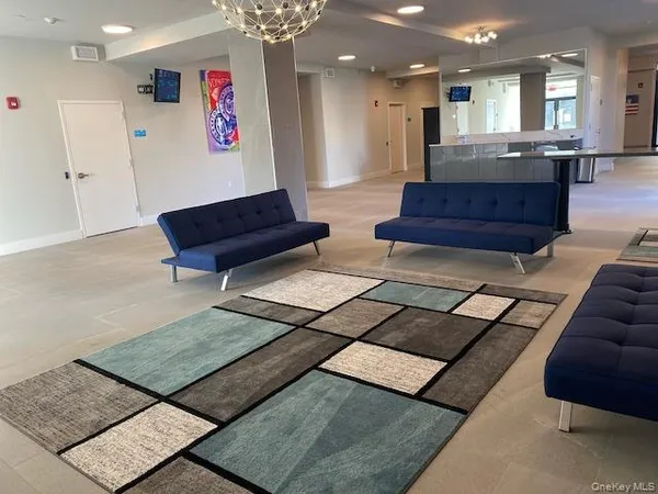 a bench with painting on the wall