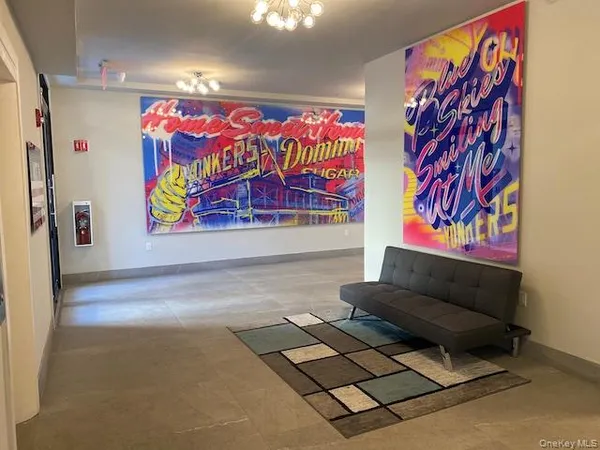 a living room with furniture and a rug