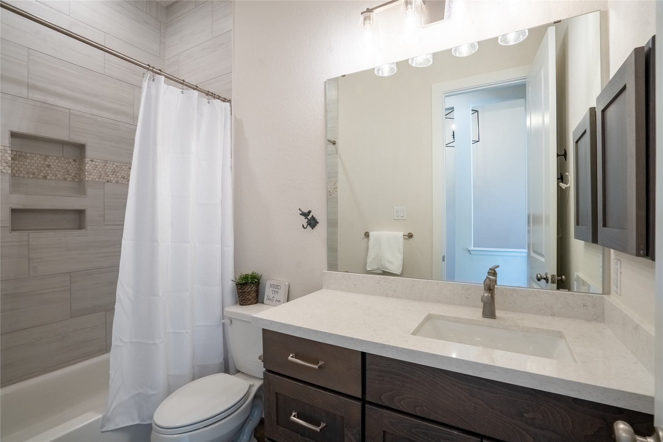 1309 Spring Gulch Lane Georgetown, TX 78628 - Photo 11 of 27 a bathroom with a sink a toilet and shower