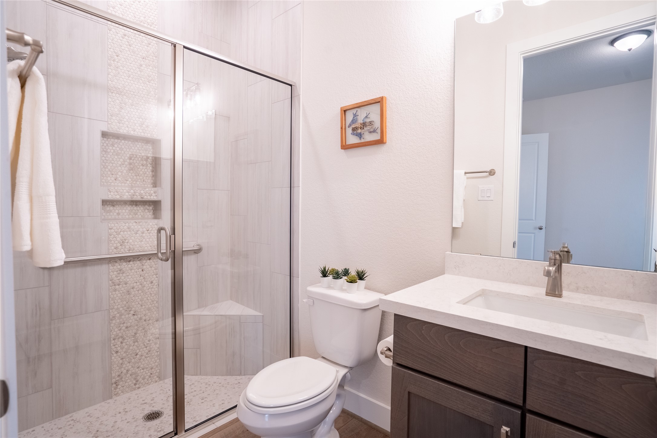 1309 Spring Gulch Lane Georgetown, TX 78628 - Photo 12 of 27 a bathroom with a sink a toilet and shower
