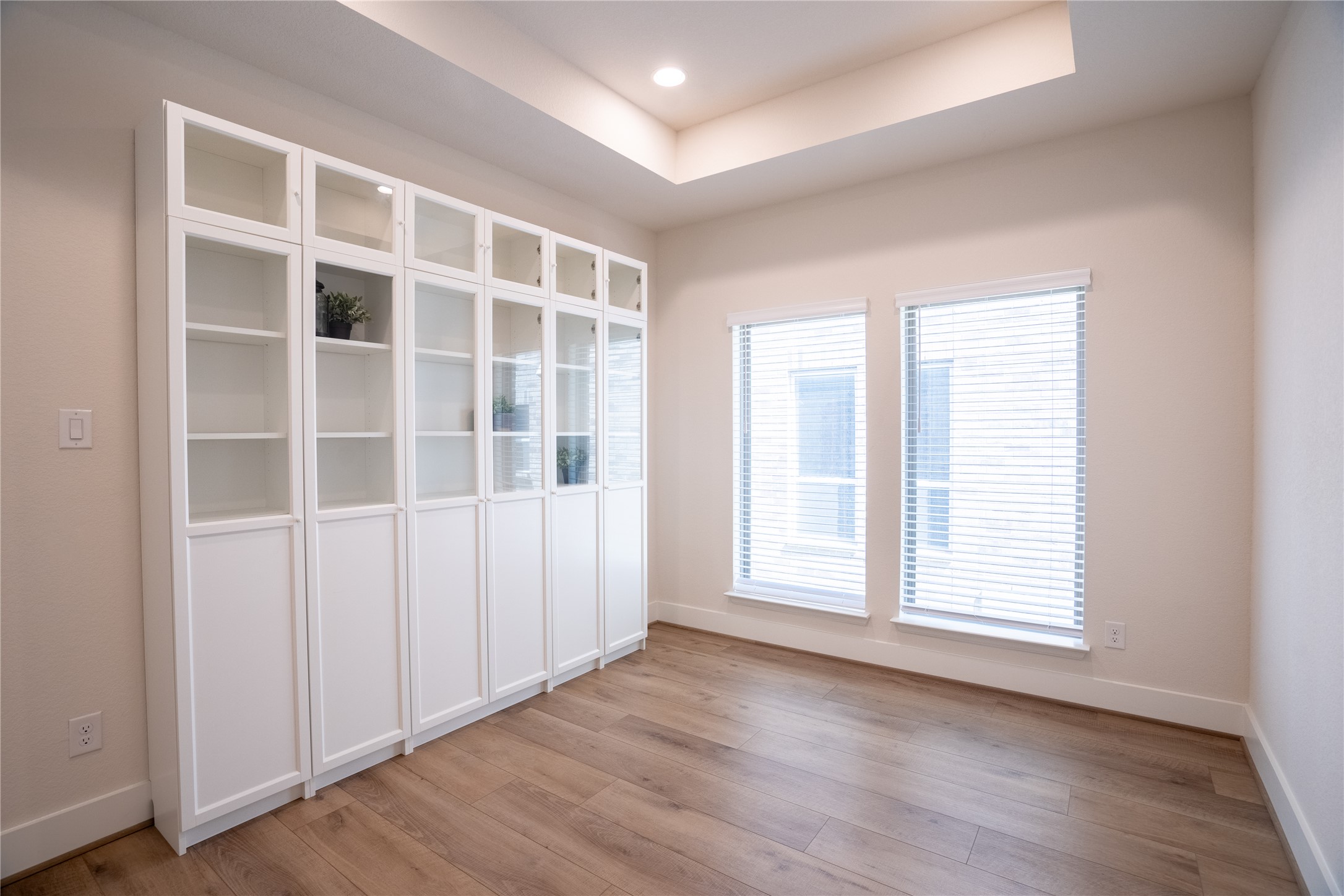 1309 Spring Gulch Lane Georgetown, TX 78628 - Photo 13 of 27 an empty room with wooden floor and windows