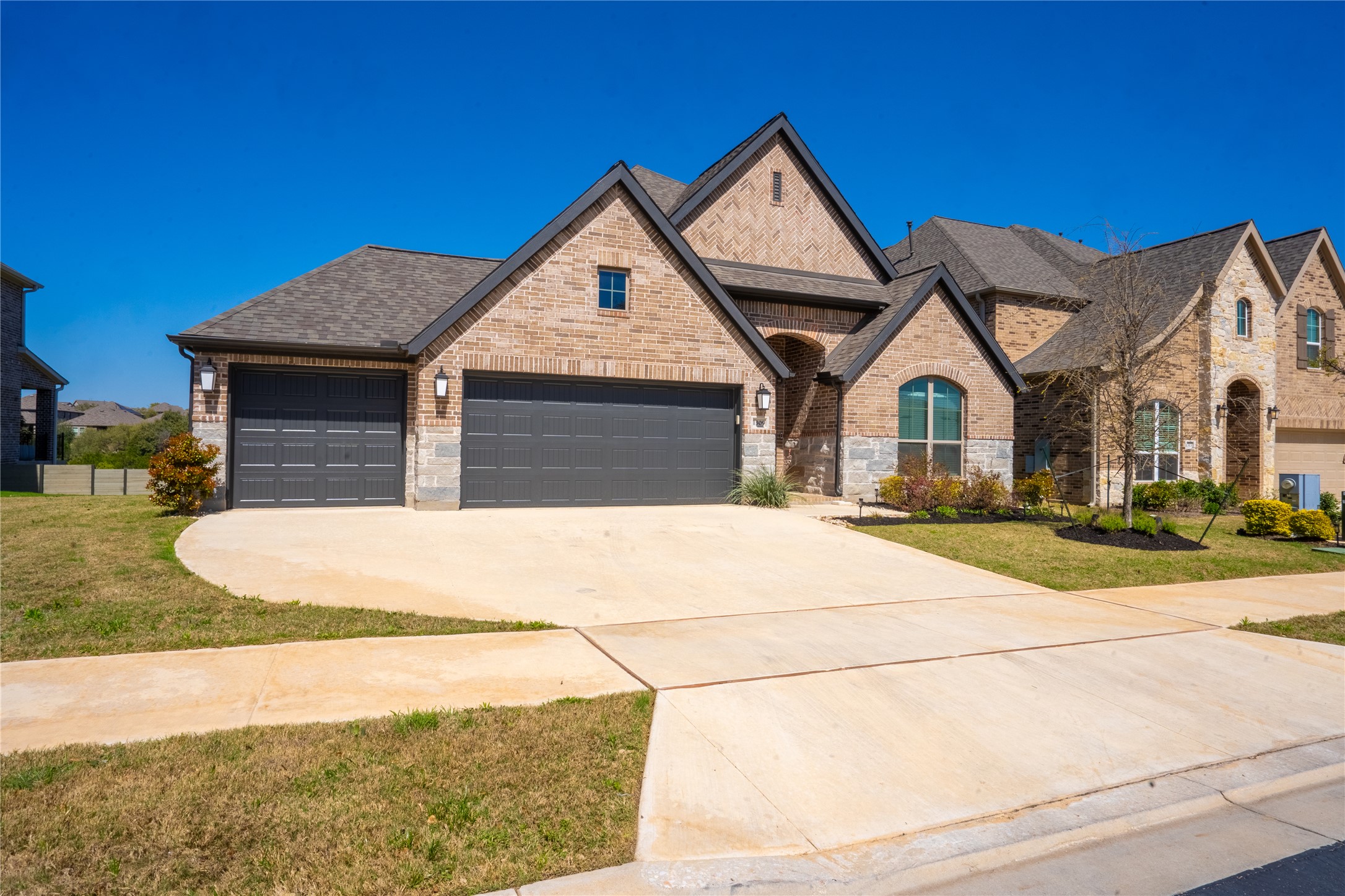 1309 Spring Gulch Lane Georgetown, TX 78628 - Photo 25 of 27 a view of multiple houses with a yard
