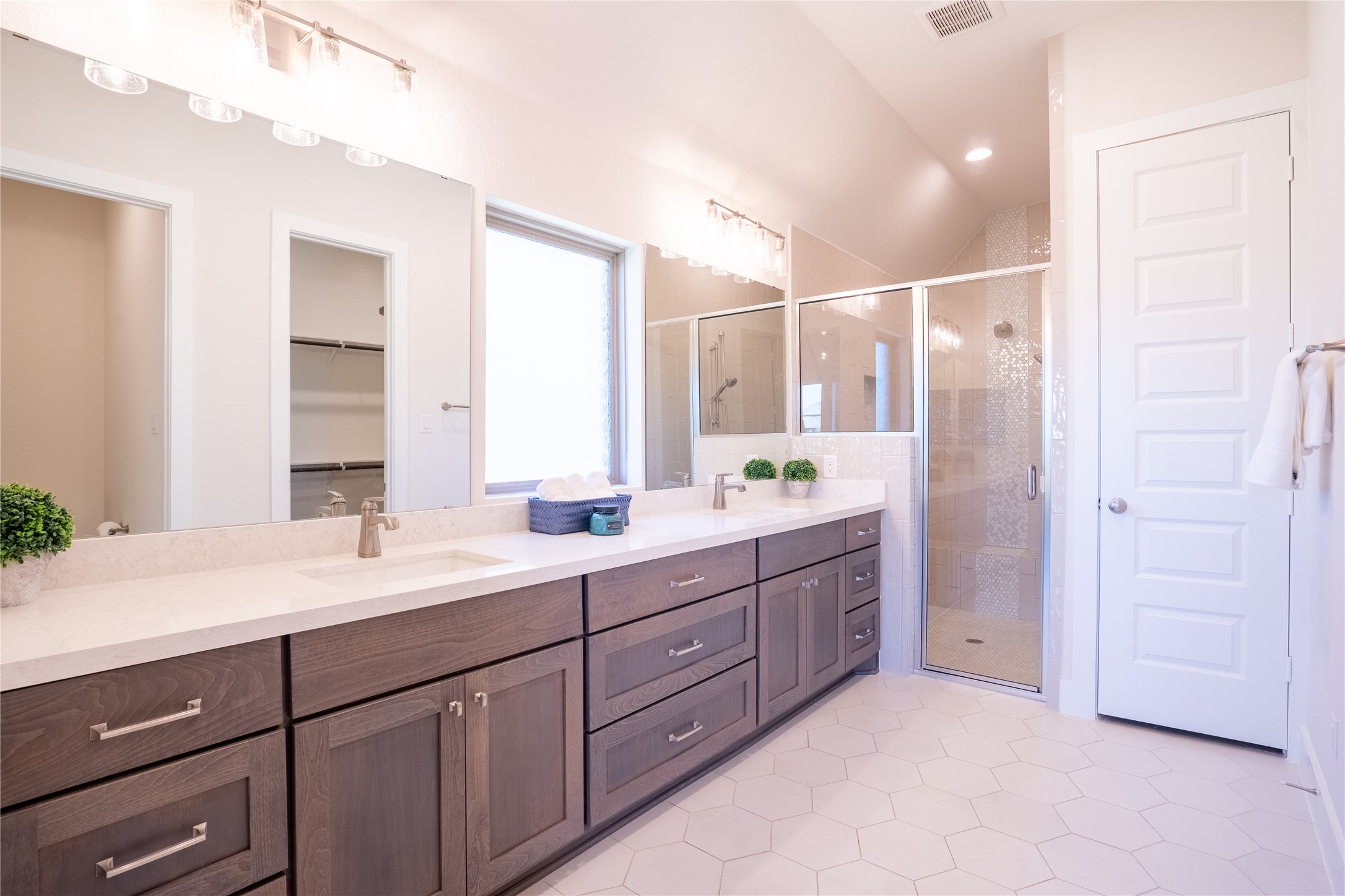 1309 Spring Gulch Lane Georgetown, TX 78628 - Photo 8 of 27 a bathroom with a double vanity sink and a mirror