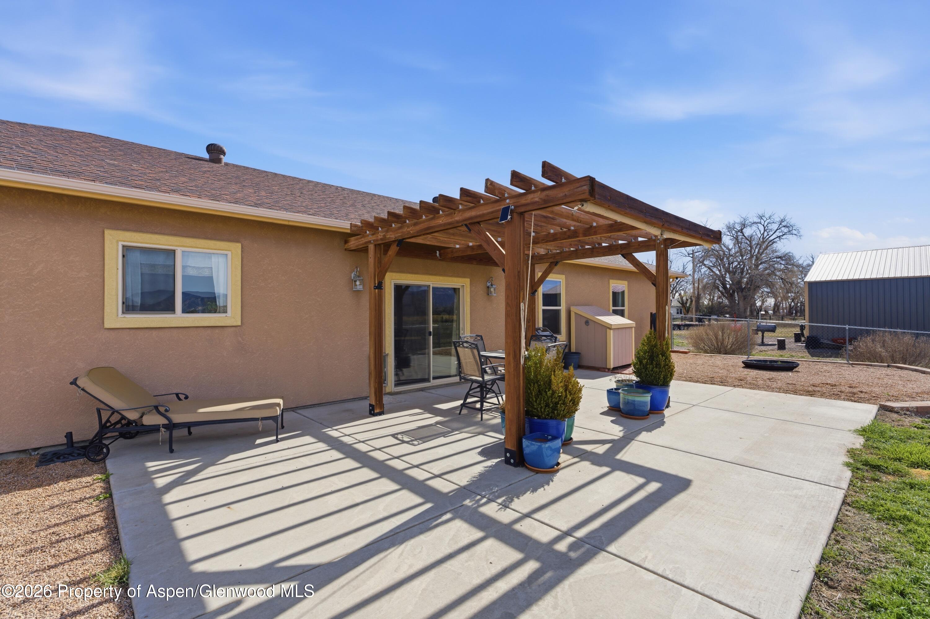 1081 20 Road Fruita, CO 81521 - Photo 30 of 43 a front view of a house with outdoor seating