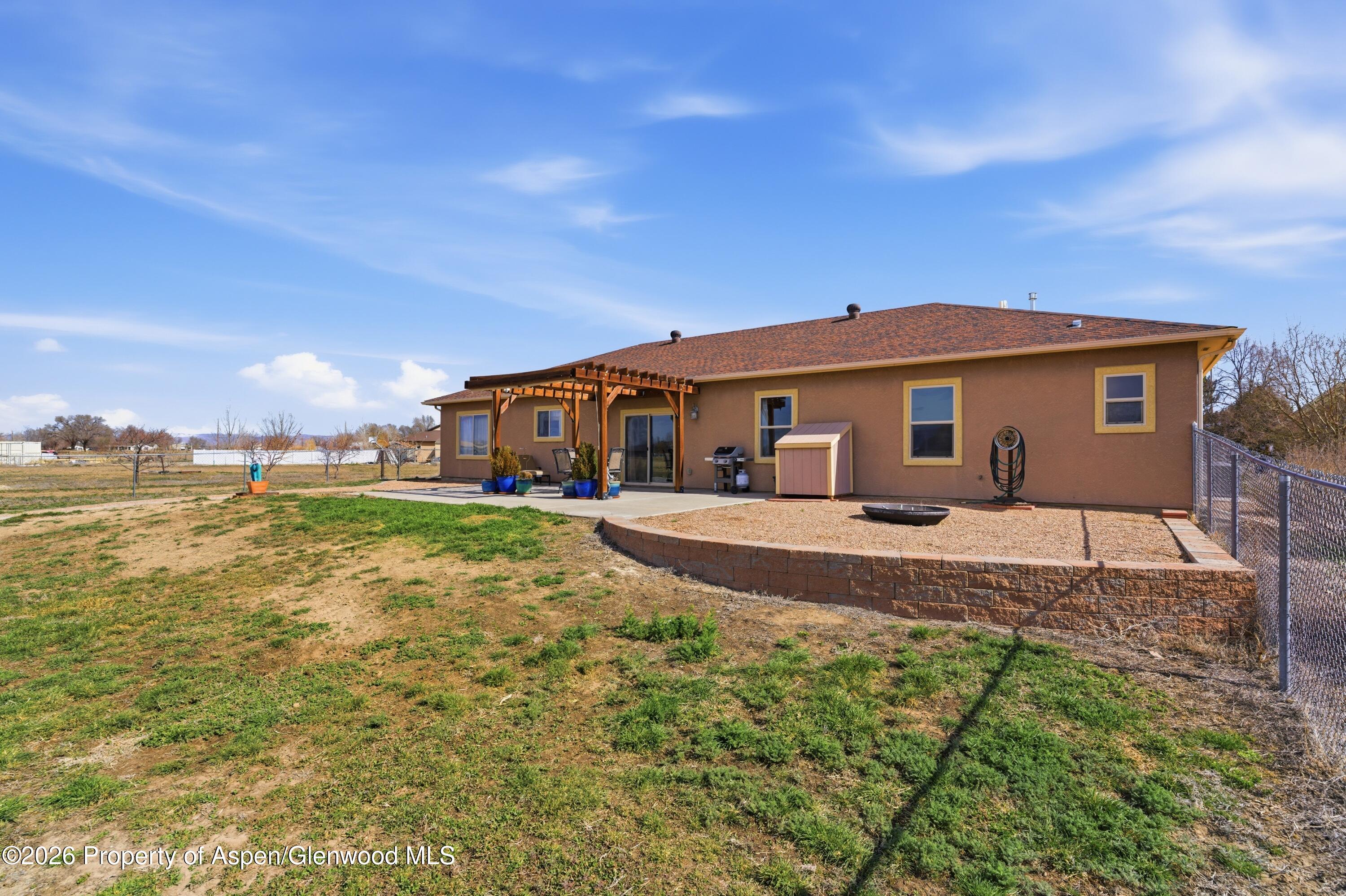 1081 20 Road Fruita, CO 81521 - Photo 31 of 43 a view of a house with a yard