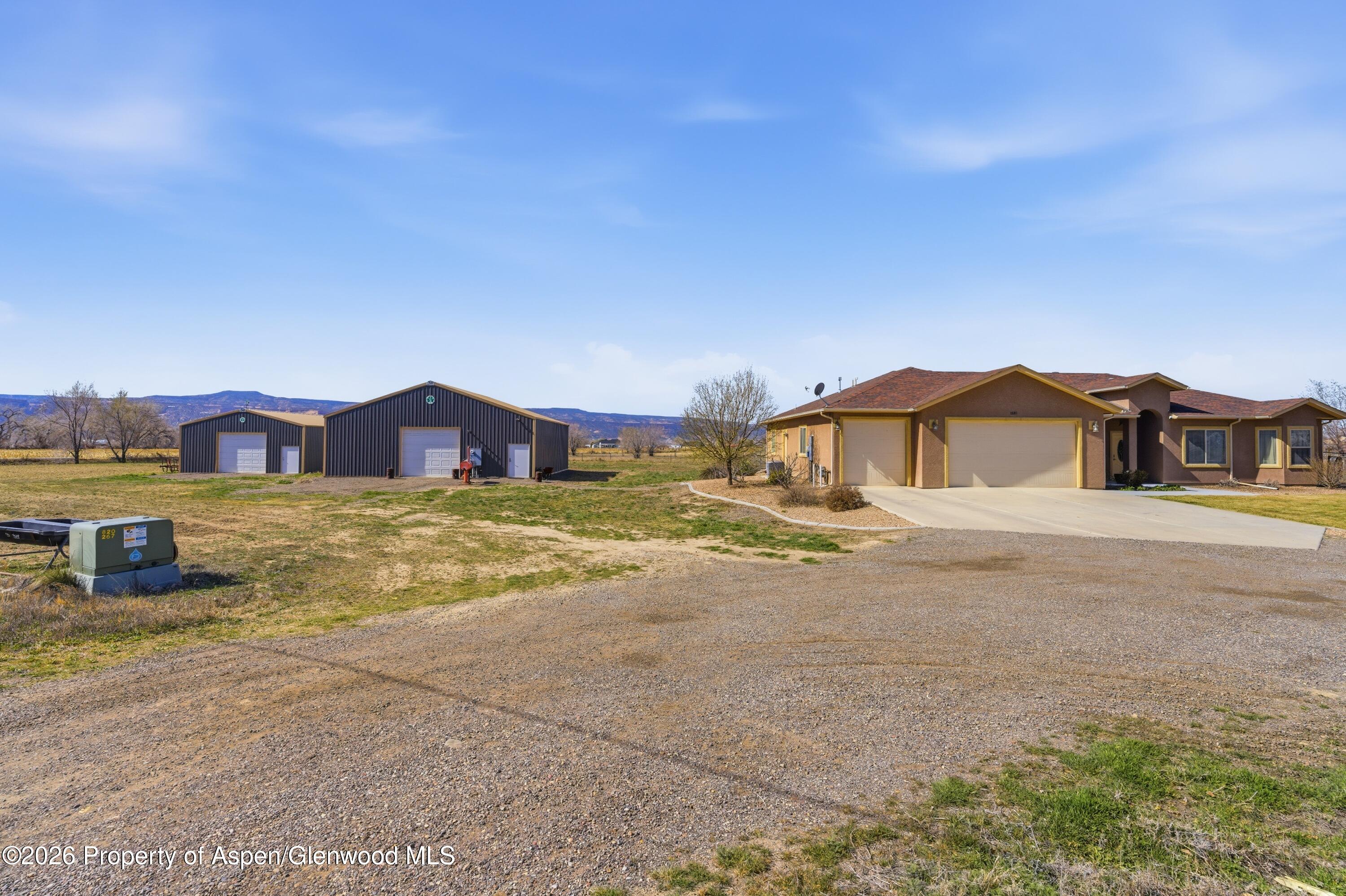 1081 20 Road Fruita, CO 81521 - Photo 32 of 43 a house view with a big yard