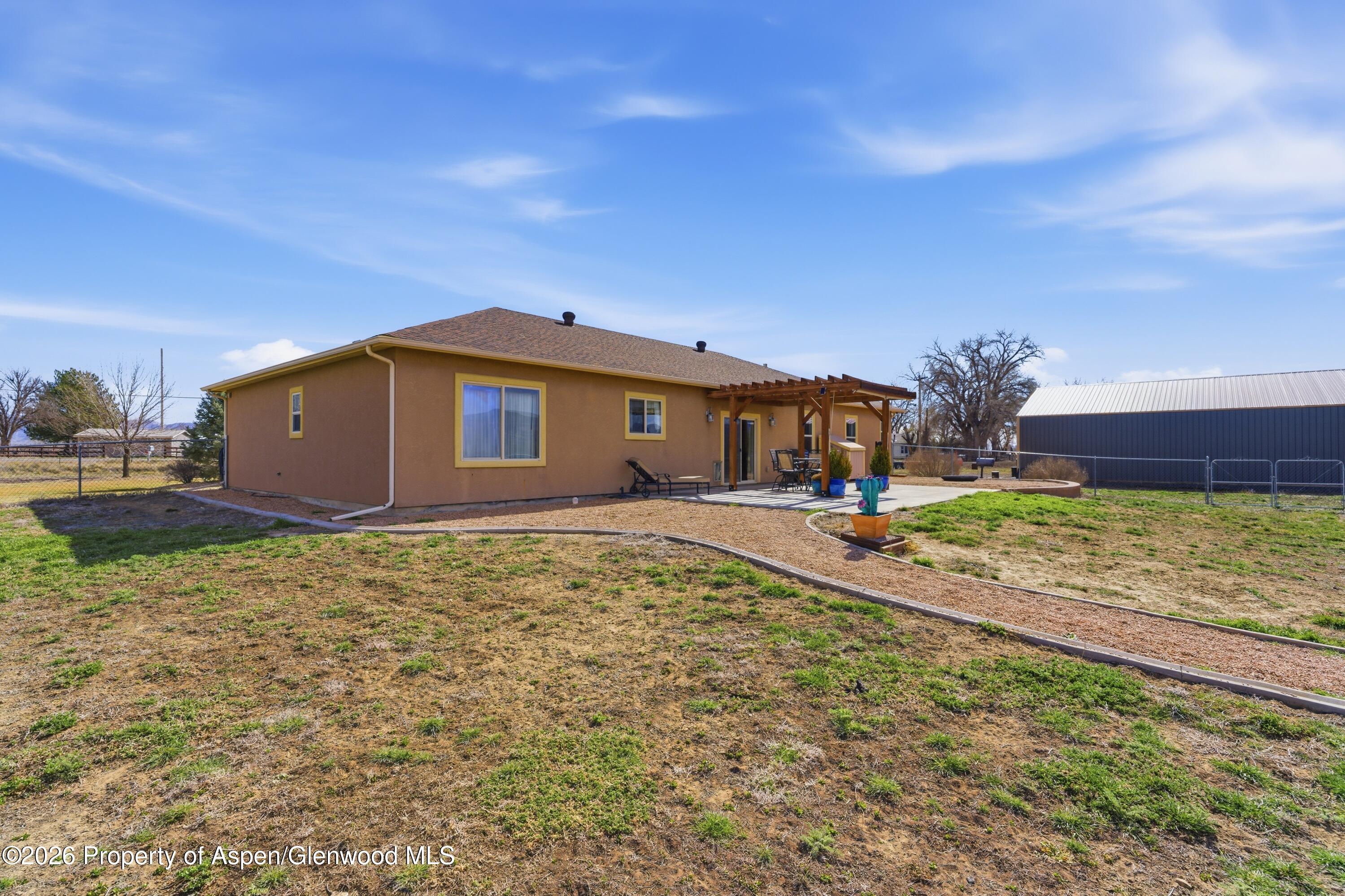 1081 20 Road Fruita, CO 81521 - Photo 41 of 43 a view of a house with backyard and sitting area