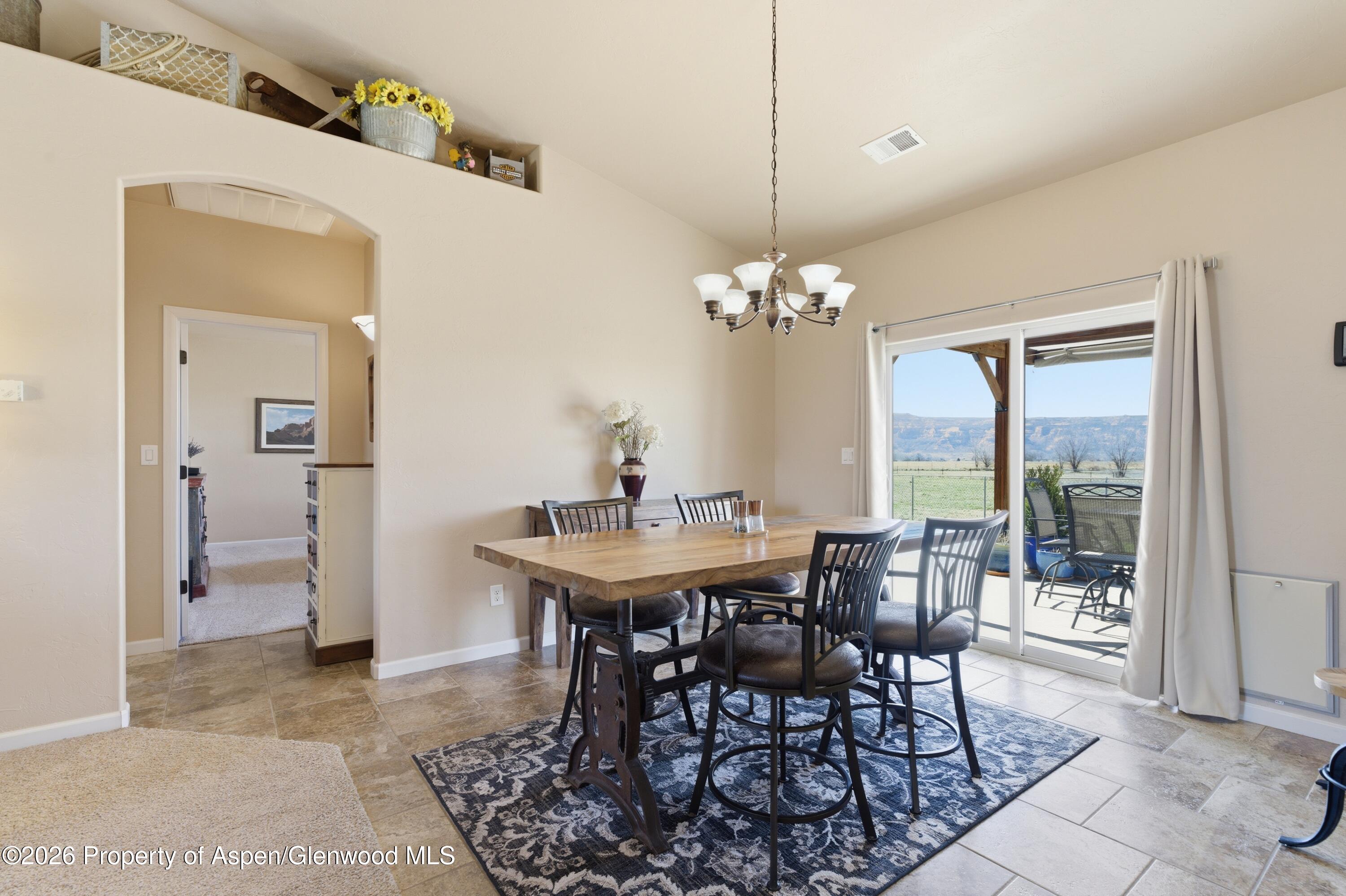 1081 20 Road Fruita, CO 81521 - Photo 5 of 43 a view of a dining room with furniture and chandelier