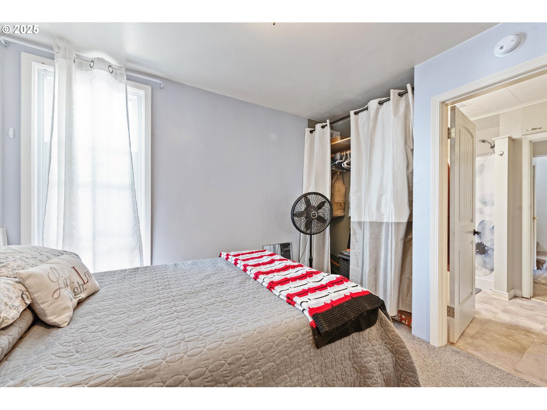 2420 9th Street Baker City, OR 97814 - Photo 17 of 47 a bedroom with a bed and a window