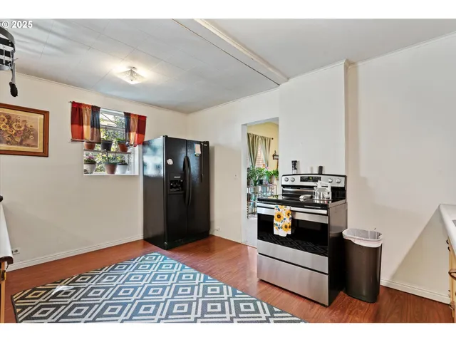 a kitchen view with appliances and cabinets