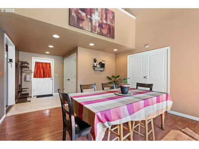 a dining room with a table and chairs