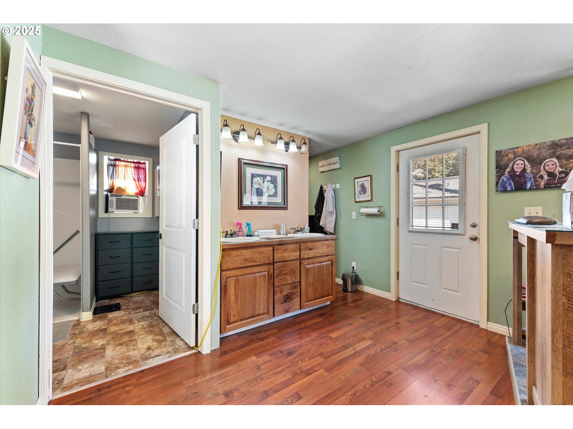 2420 9th Street Baker City, OR 97814 - Photo 29 of 47 a kitchen with cabinets and wooden floor