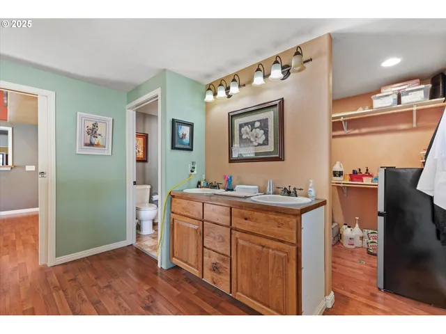 a kitchen with stainless steel appliances granite countertop a refrigerator and a stove