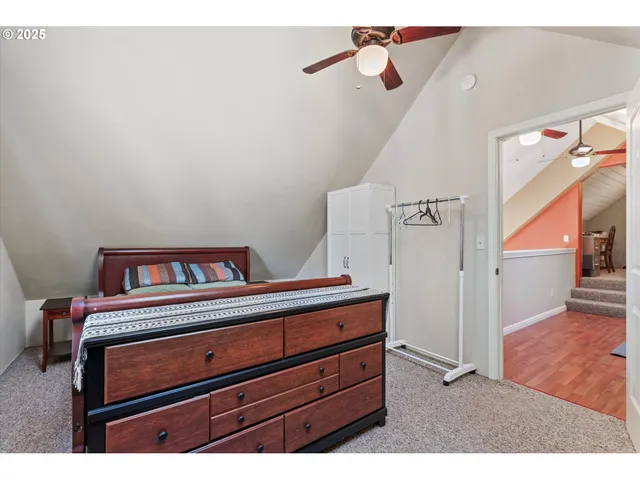 a bedroom with furniture and a window