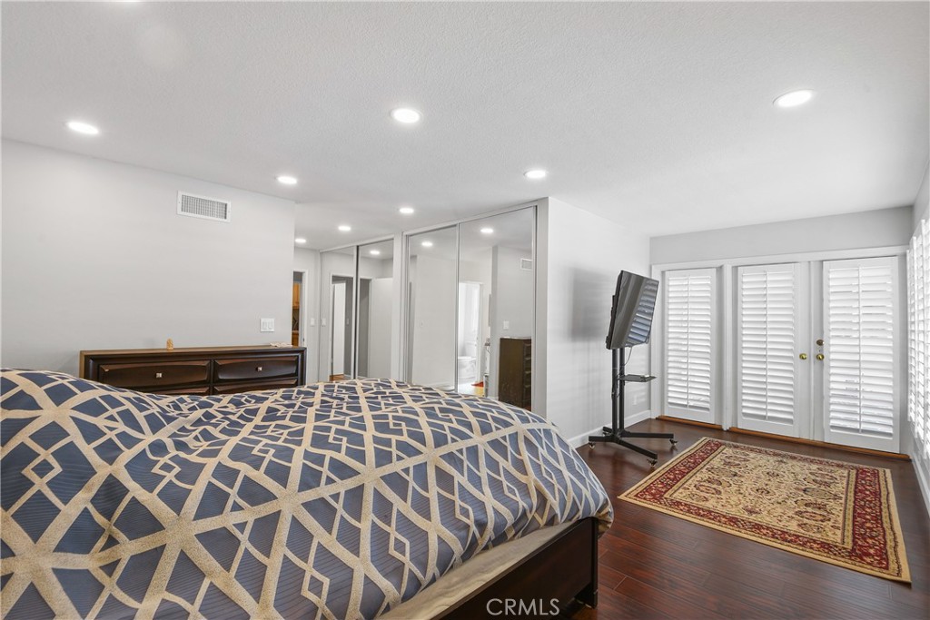 13092 Ranchwood Road Tustin, CA 92782 - Photo 13 of 17 a bedroom with a bed and a window