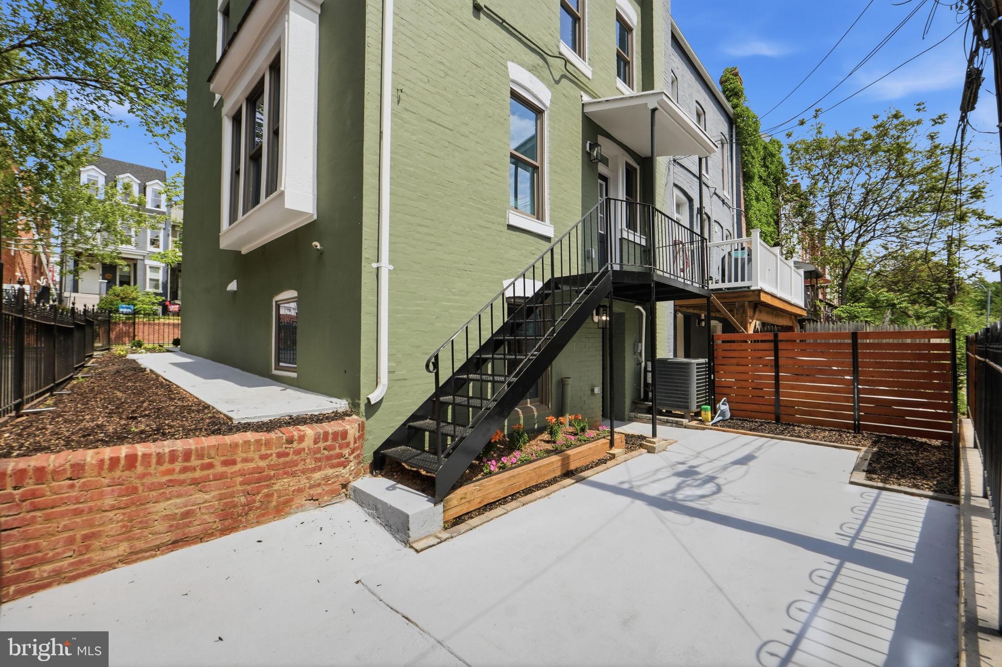 518 Columbia Road Northwest Washington, DC 20001 - Photo 33 of 35 Charming green exterior with garden space.
