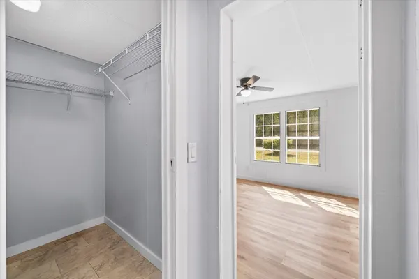 a view of an empty room with a window