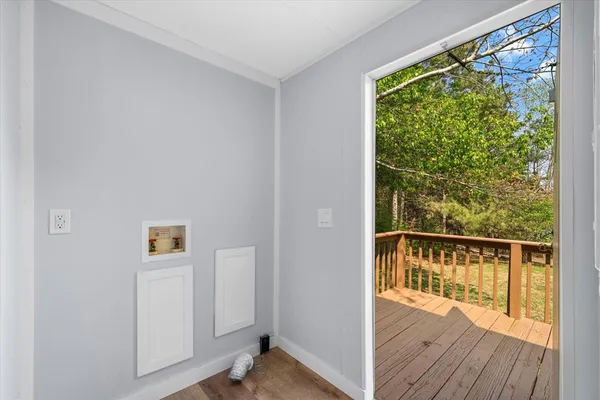 a view of a balcony with wooden floor