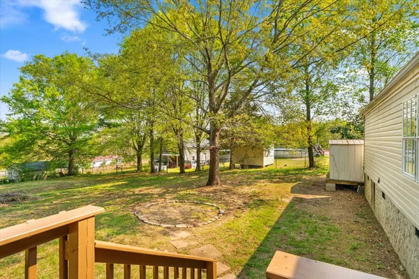 a view of a patio with a yard