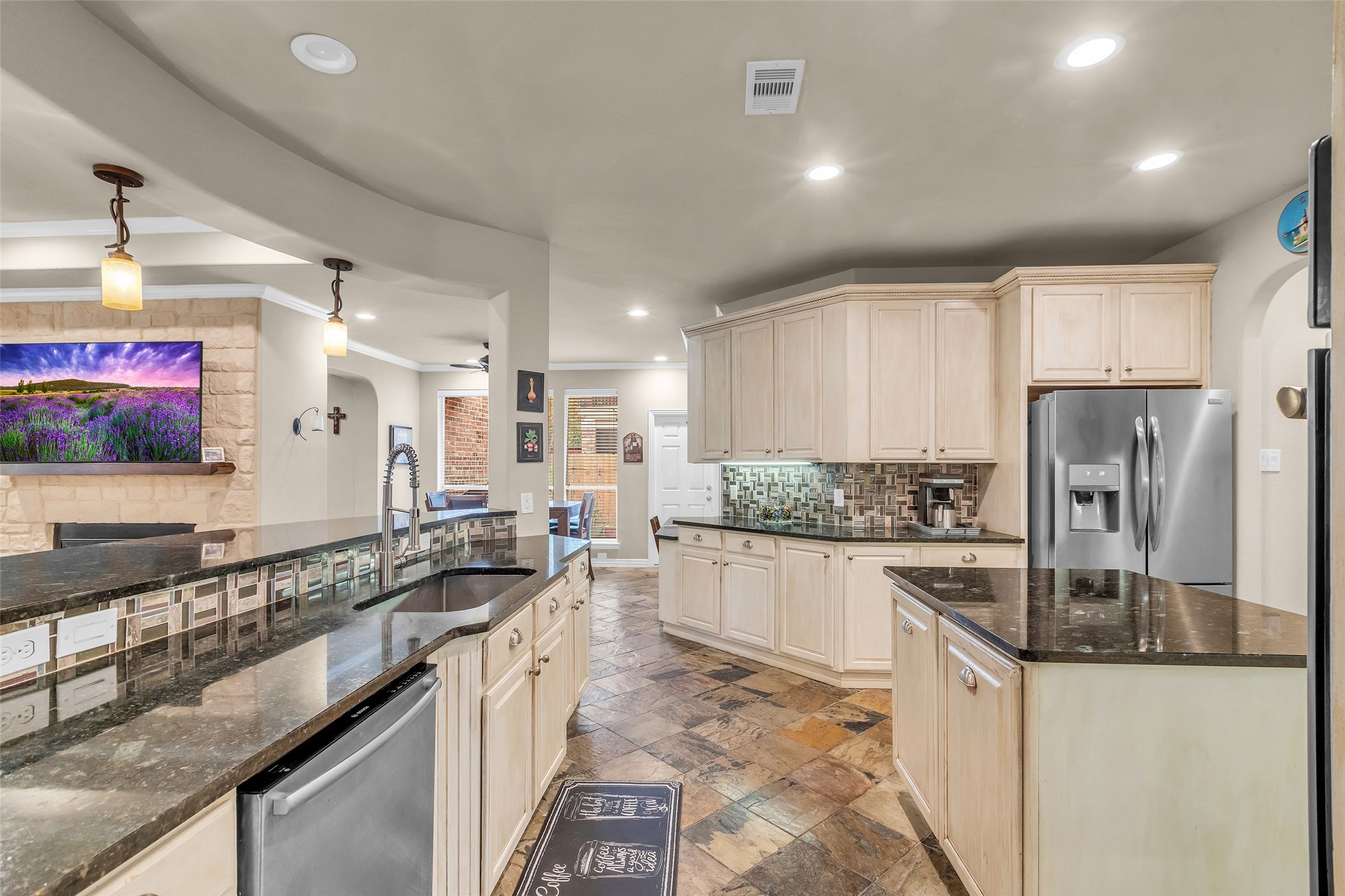1622 Beau Rivage Conroe, TX 77304 - Photo 11 of 37 a kitchen with stainless steel appliances granite countertop a sink stove and refrigerator