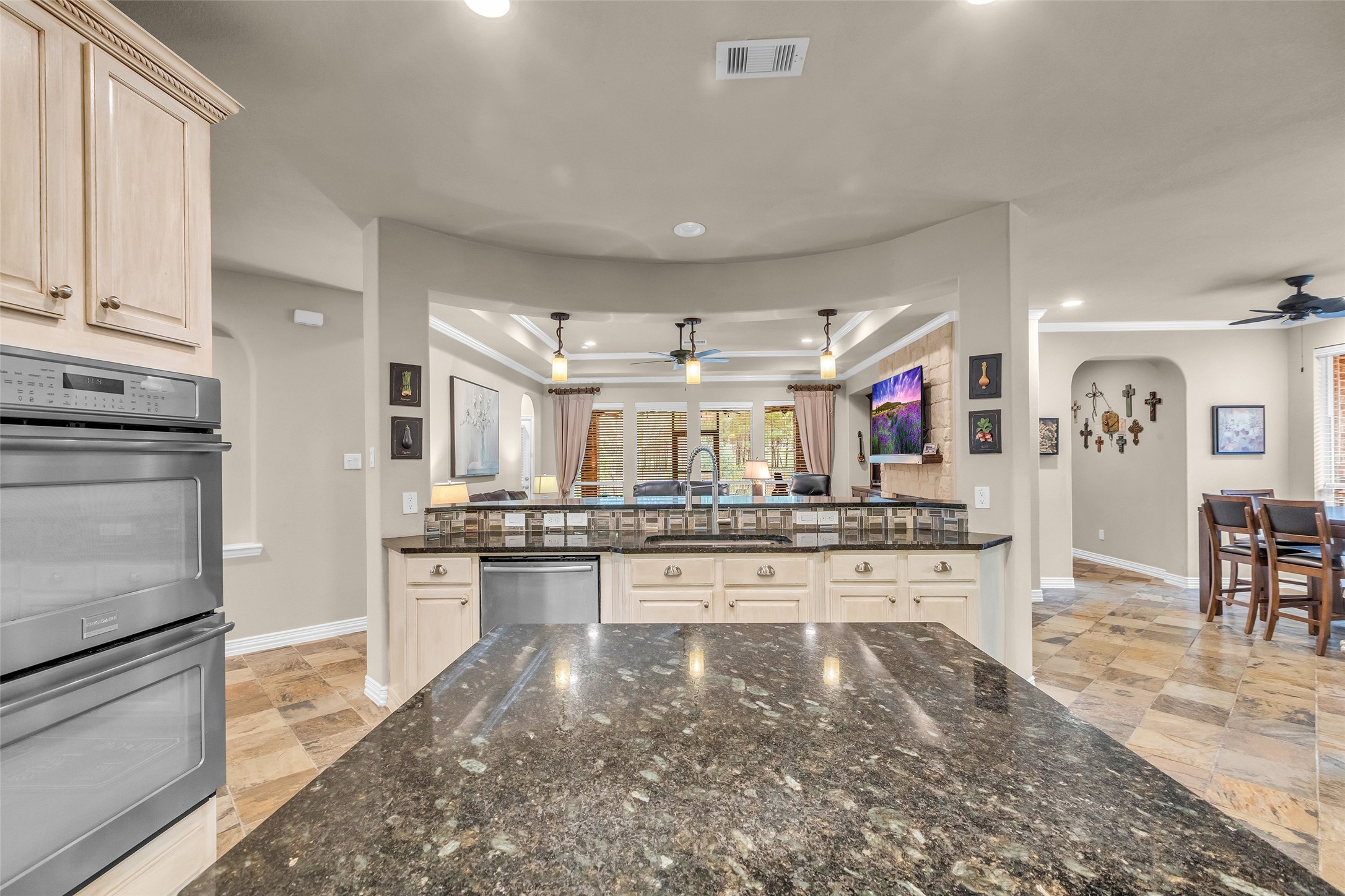 1622 Beau Rivage Conroe, TX 77304 - Photo 14 of 37 a kitchen with stainless steel appliances granite countertop a sink stove and refrigerator