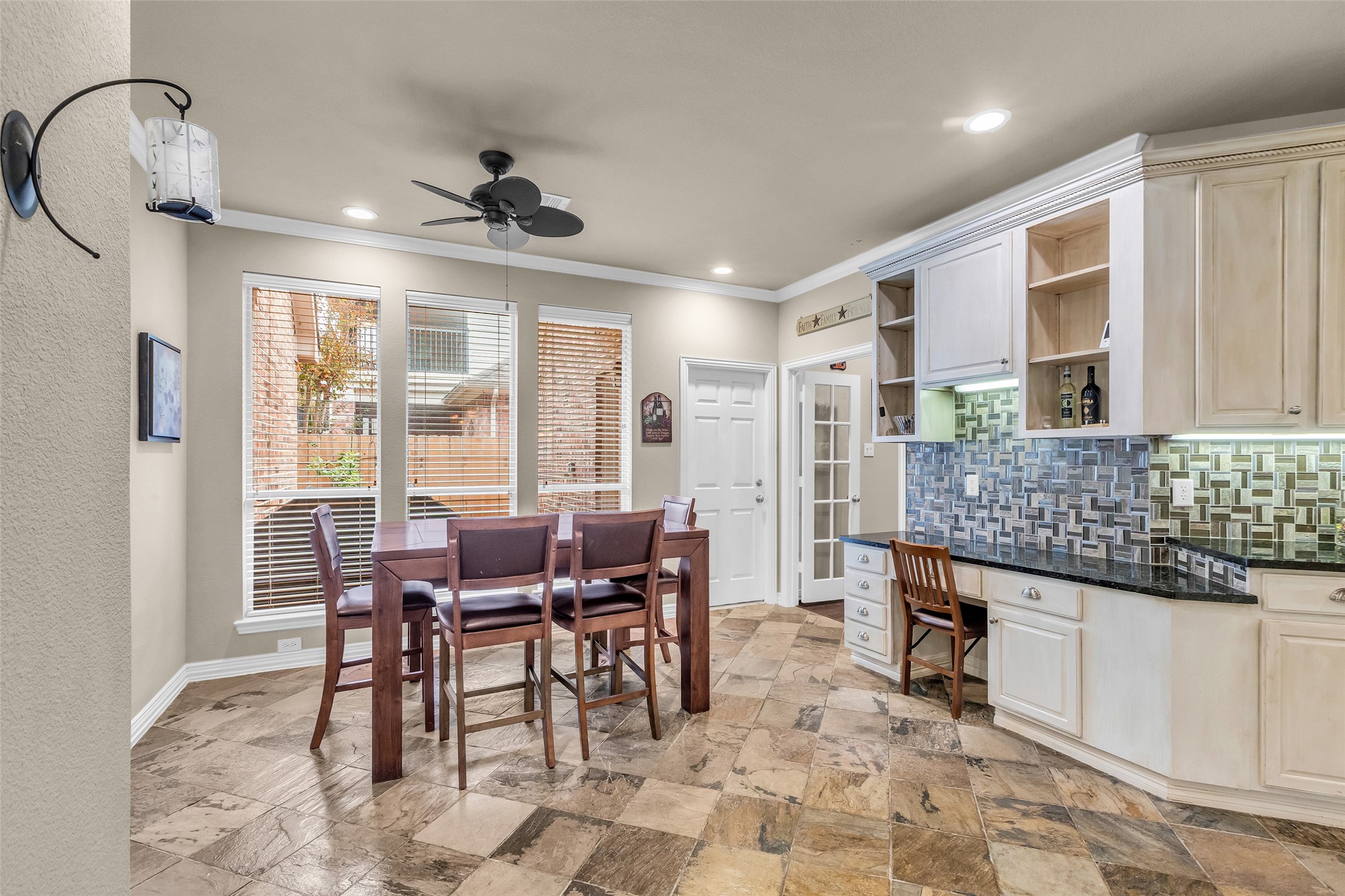 1622 Beau Rivage Conroe, TX 77304 - Photo 16 of 37 a dining room with chandelier