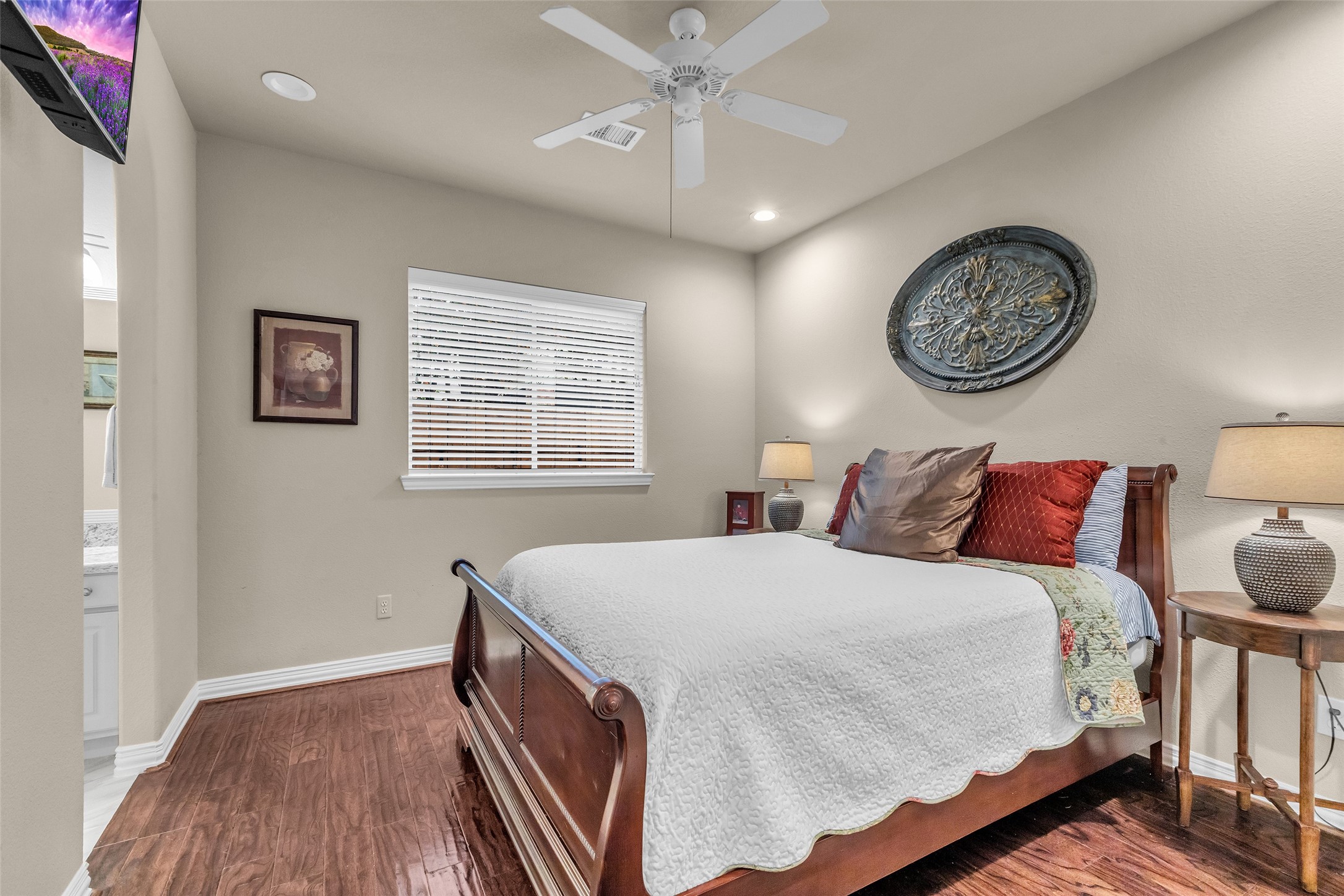 1622 Beau Rivage Conroe, TX 77304 - Photo 19 of 37 a bedroom with a bed and a window