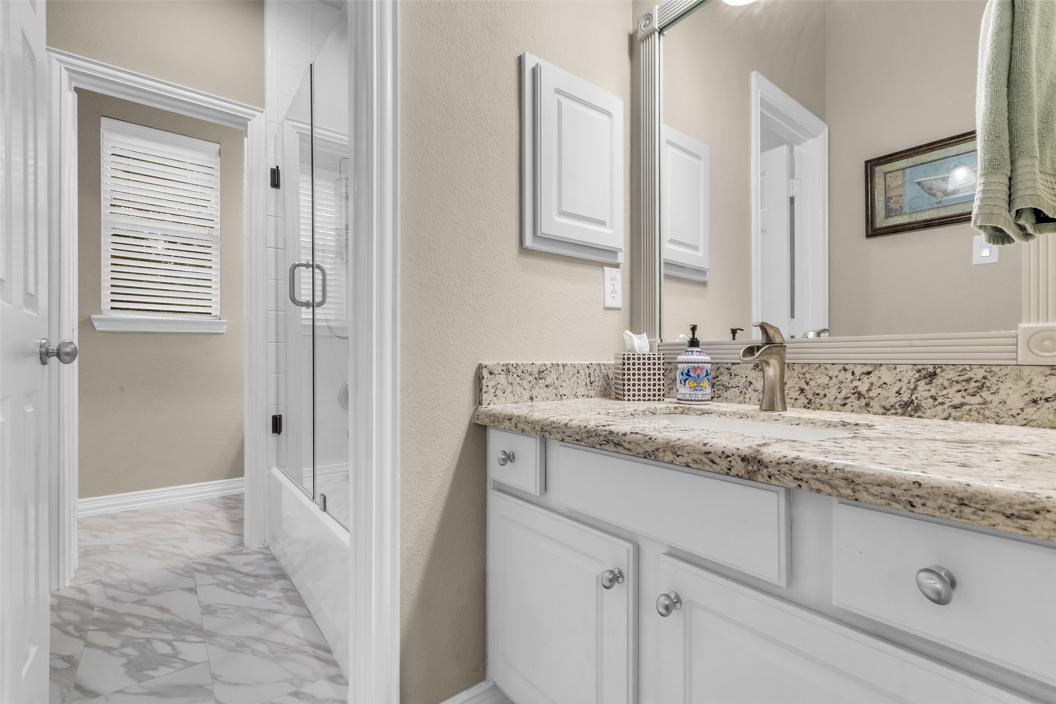 1622 Beau Rivage Conroe, TX 77304 - Photo 20 of 37 a bathroom with a granite countertop sink and a mirror