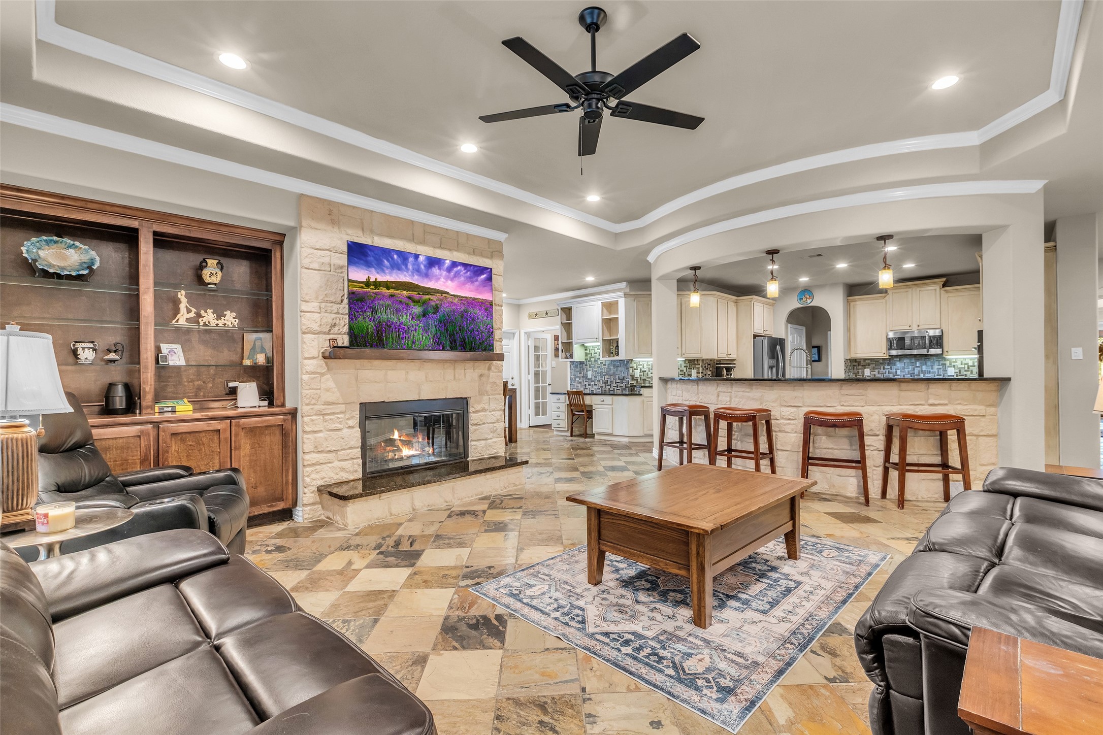 1622 Beau Rivage Conroe, TX 77304 - Photo 37 of 37 a living room with furniture and a fireplace