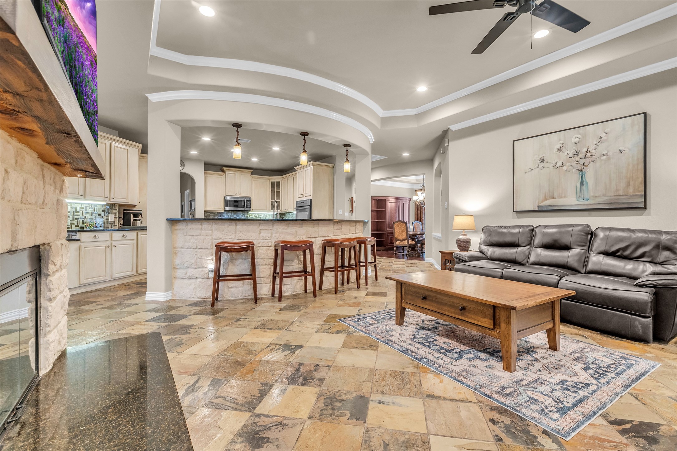 1622 Beau Rivage Conroe, TX 77304 - Photo 23 of 37 a living room with stainless steel appliances kitchen island granite countertop furniture and a kitchen view