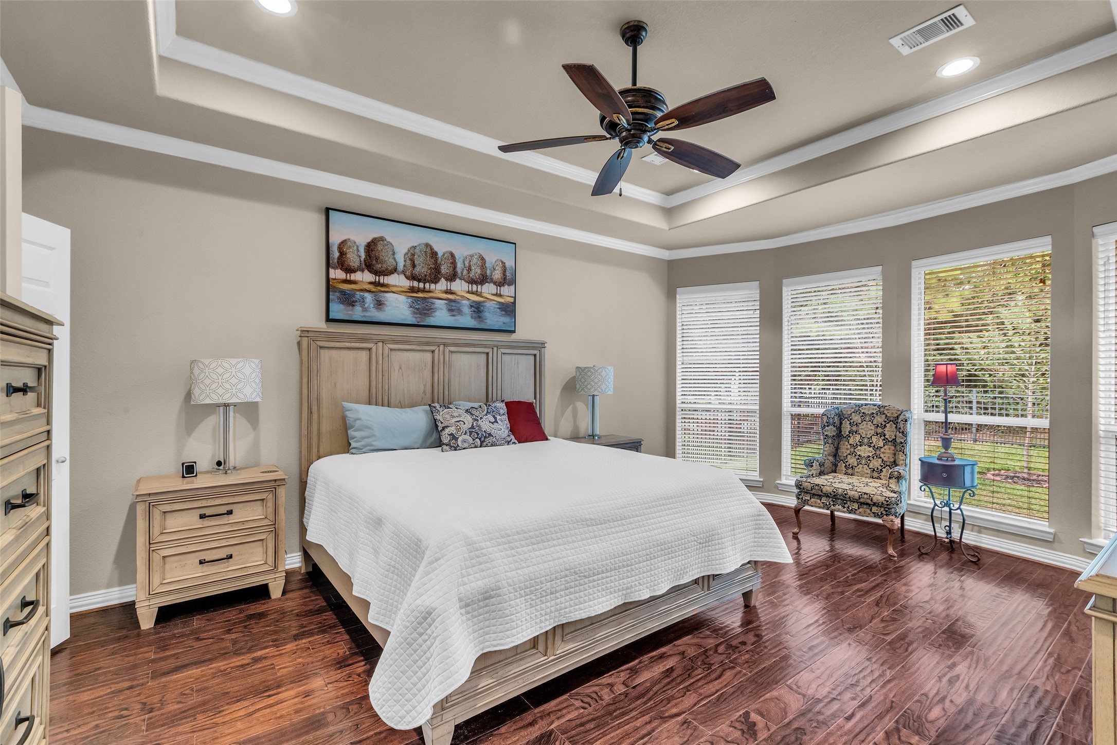 1622 Beau Rivage Conroe, TX 77304 - Photo 24 of 37 a bedroom with a large bed and a large window