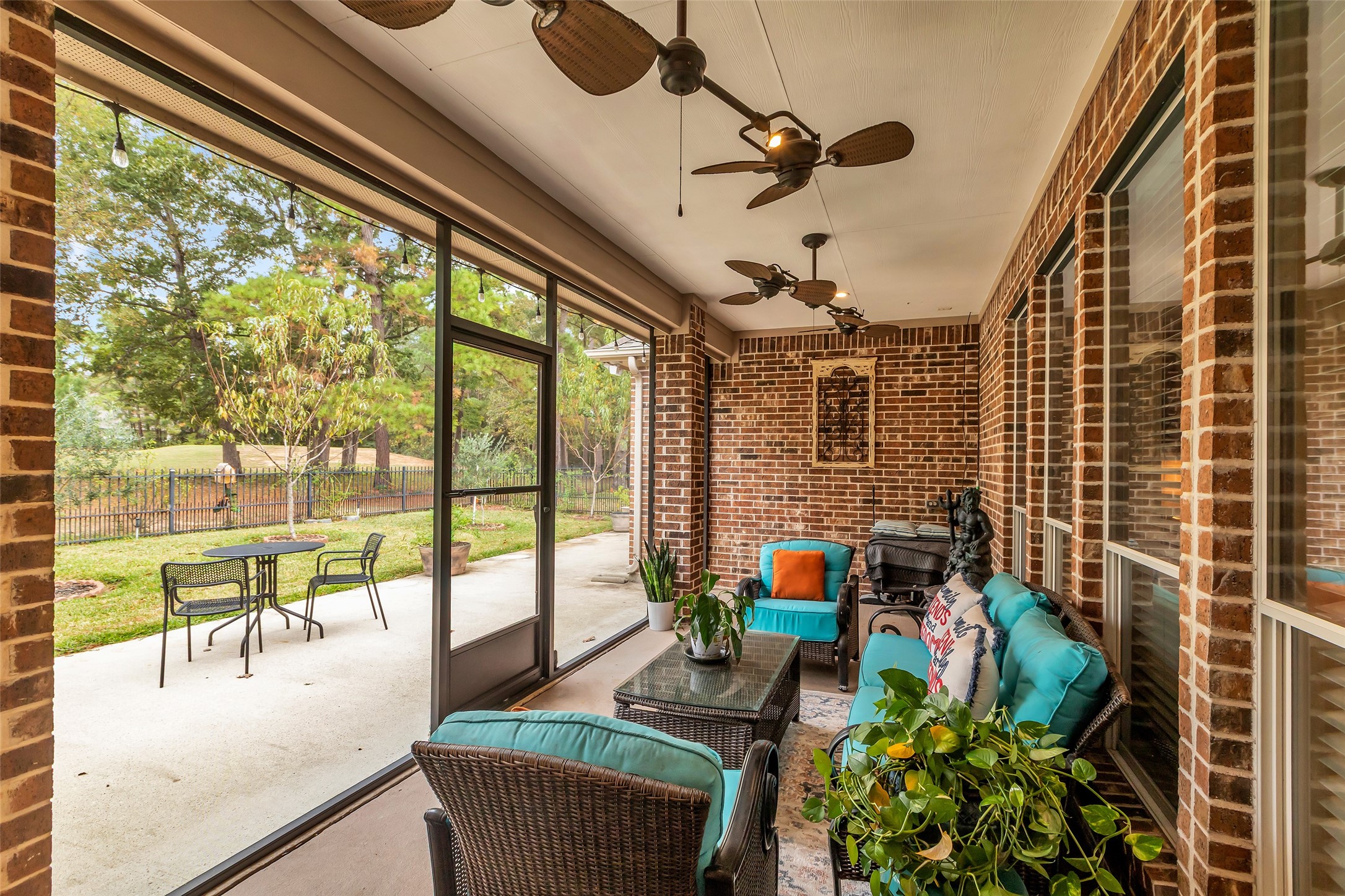 1622 Beau Rivage Conroe, TX 77304 - Photo 27 of 37 a living room with furniture and a floor to ceiling window