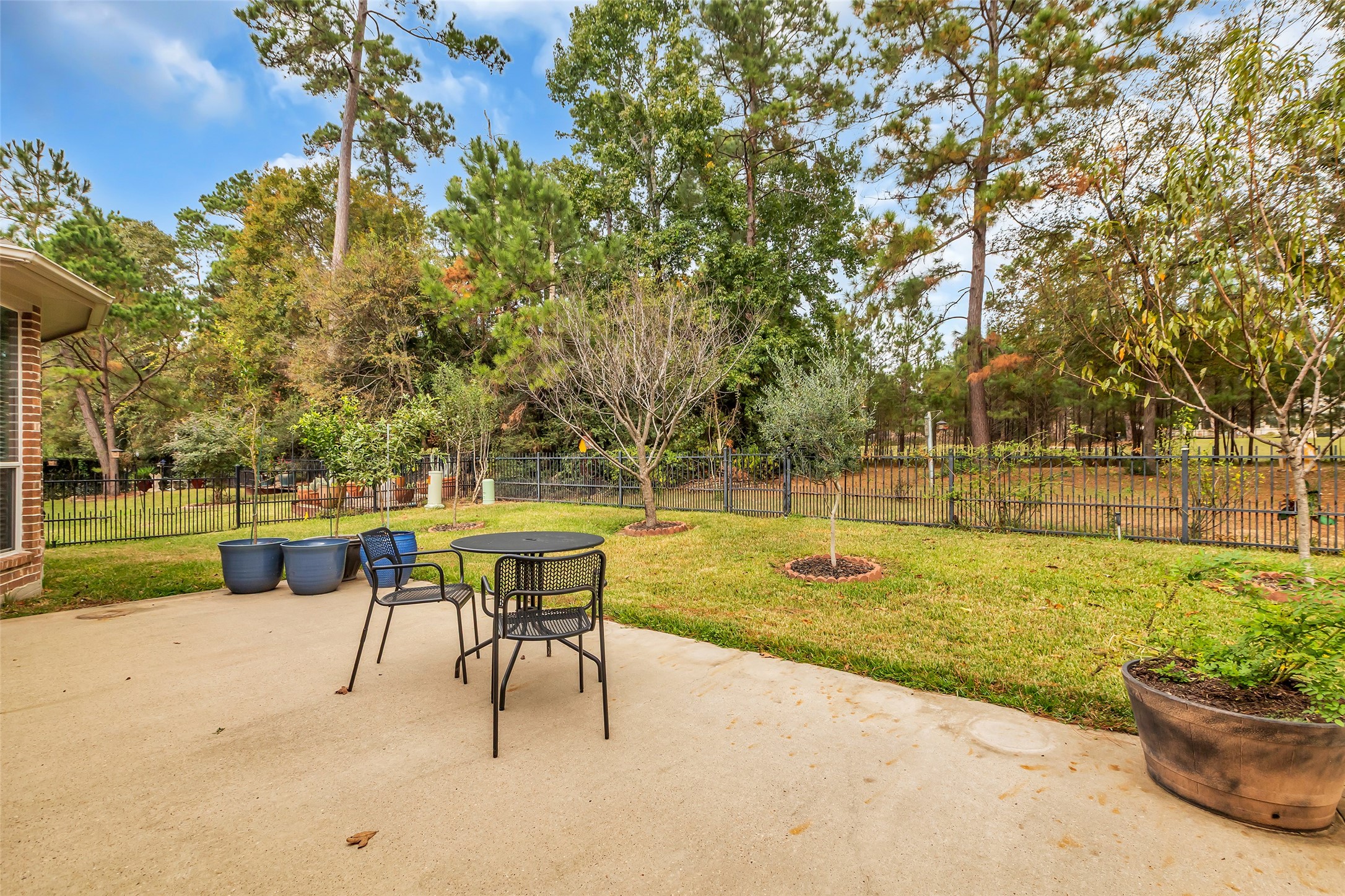 1622 Beau Rivage Conroe, TX 77304 - Photo 29 of 37 a view of a swimming pool with a table and chairs