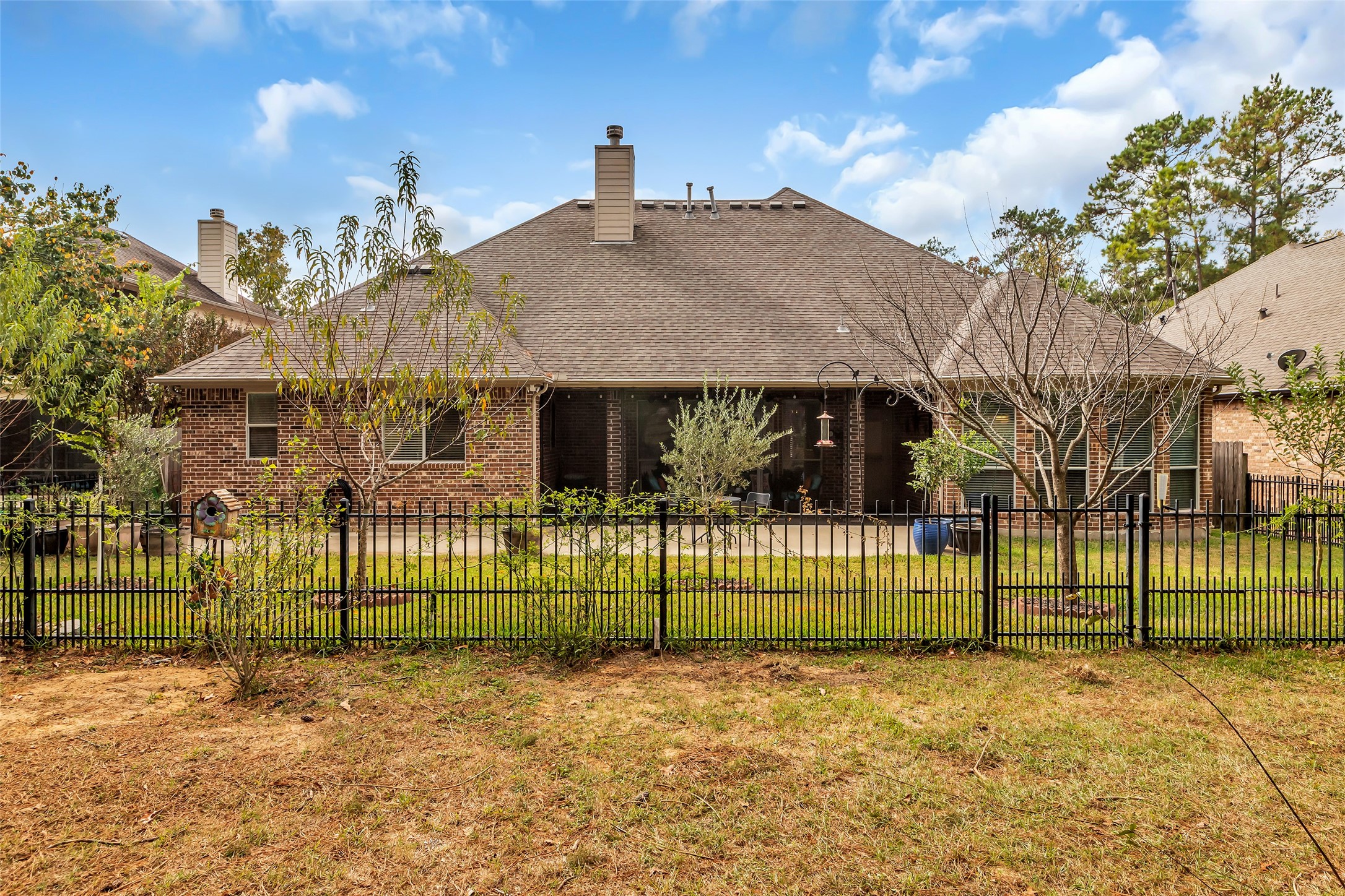 1622 Beau Rivage Conroe, TX 77304 - Photo 30 of 37 a view of a house with a iron gate