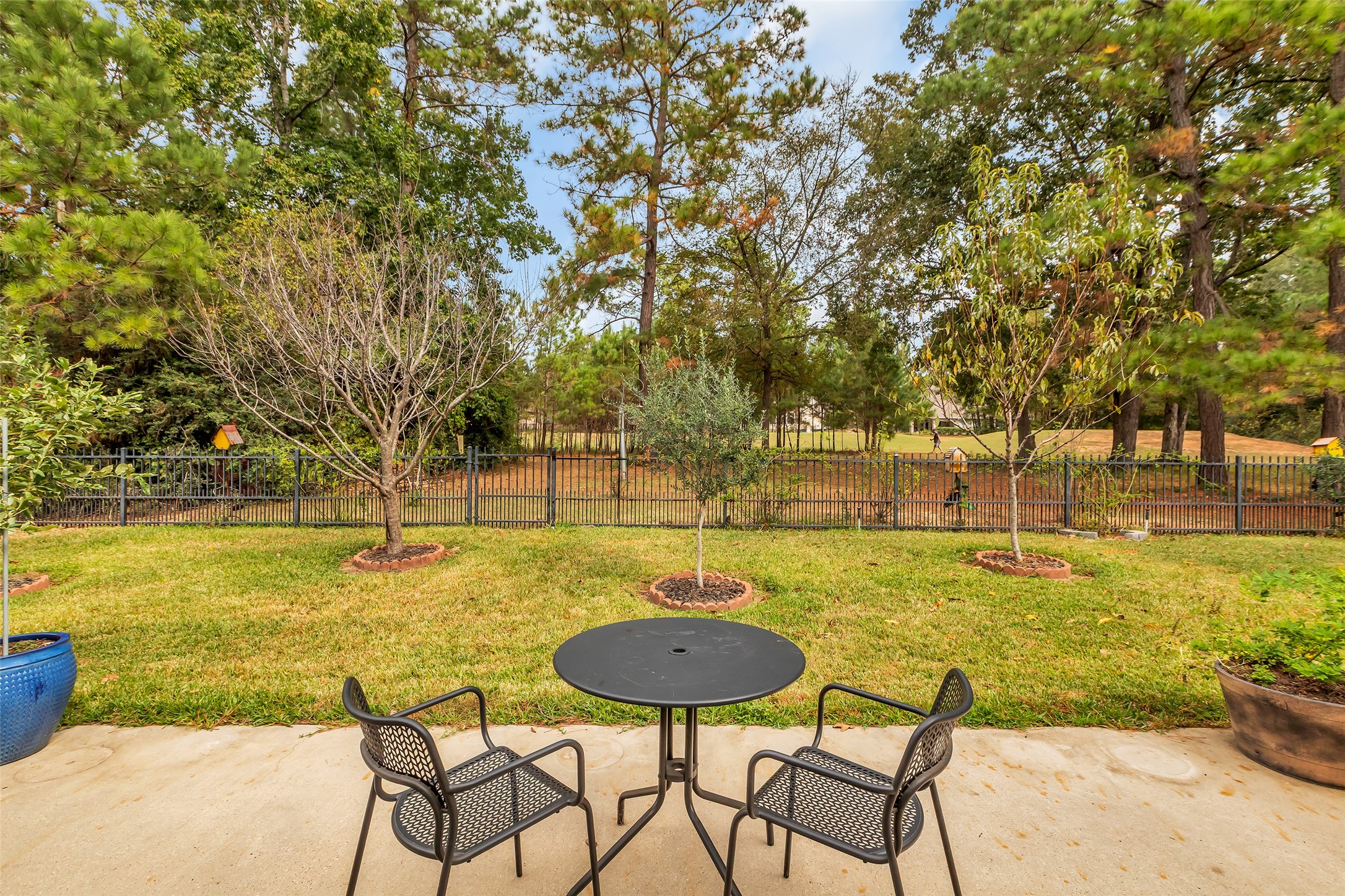1622 Beau Rivage Conroe, TX 77304 - Photo 33 of 37 a view of a swimming pool with an outdoor seating