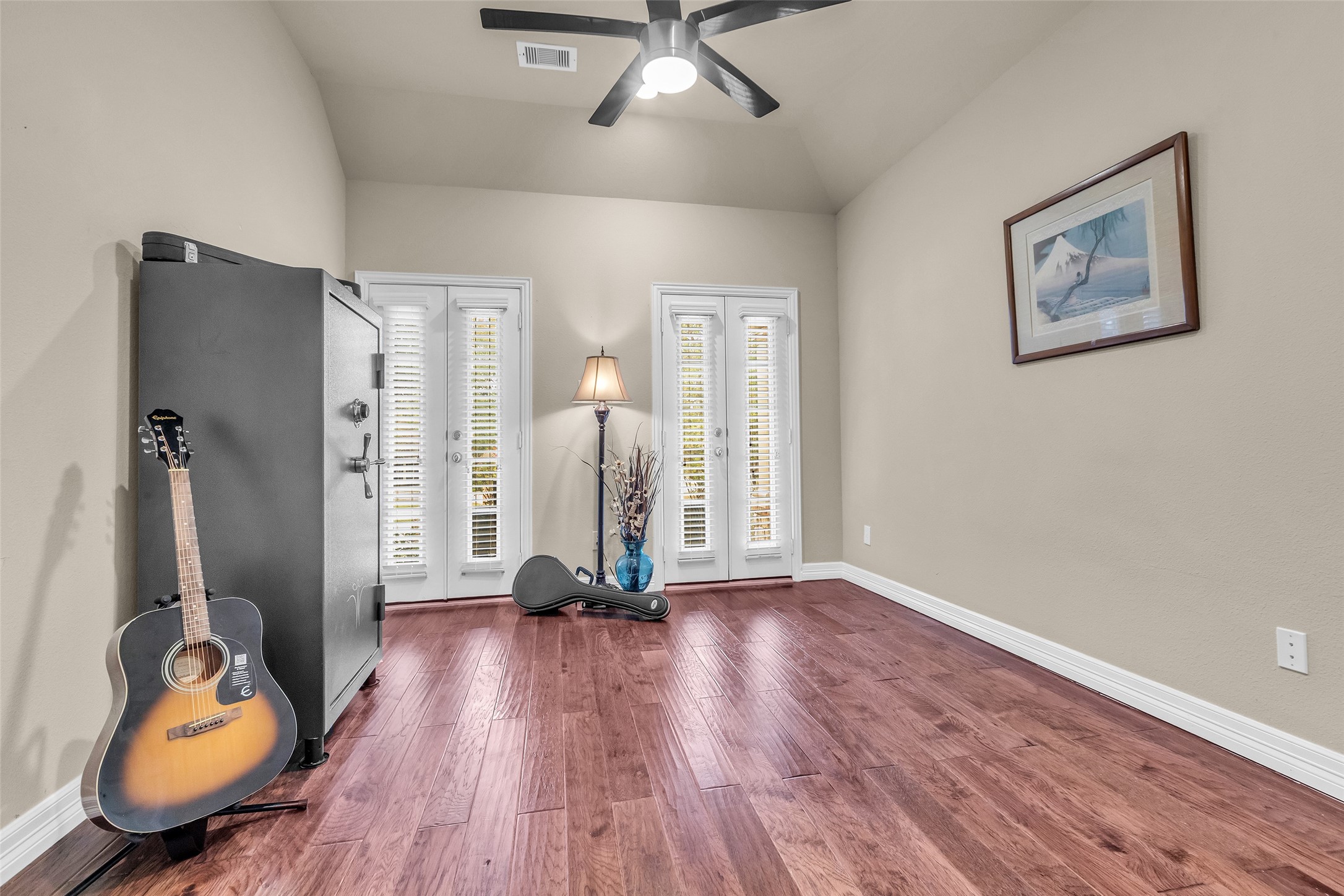 1622 Beau Rivage Conroe, TX 77304 - Photo 36 of 37 a view of room with gym equipment and wooden floor