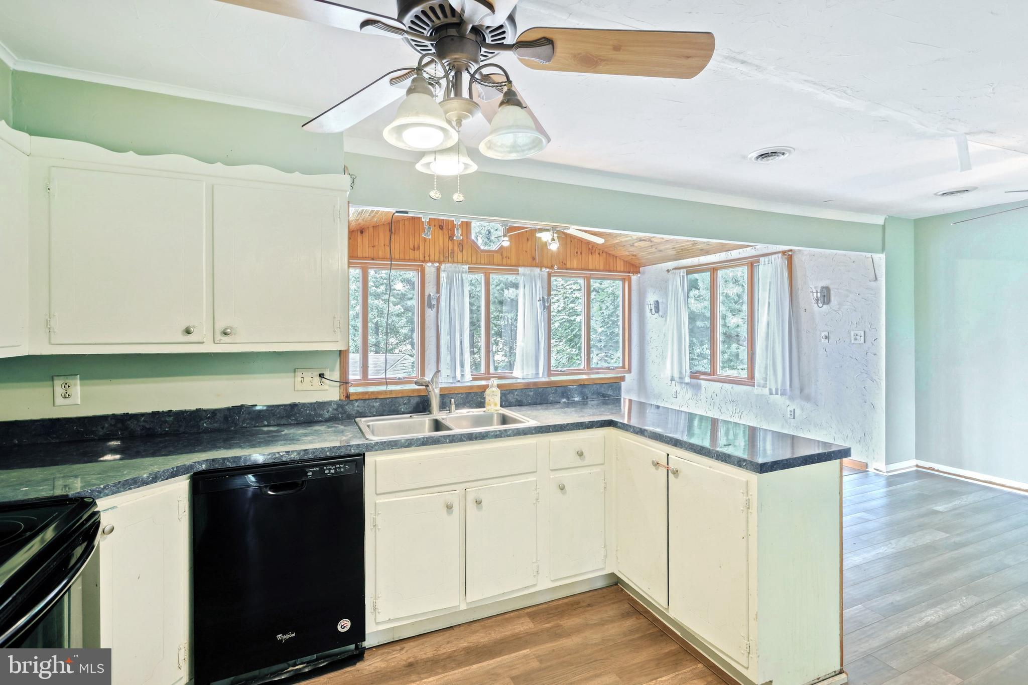 147 Mud College Road Littlestown, PA 17340 - Photo 13 of 43 a kitchen that has a lot of cabinets and wooden floor